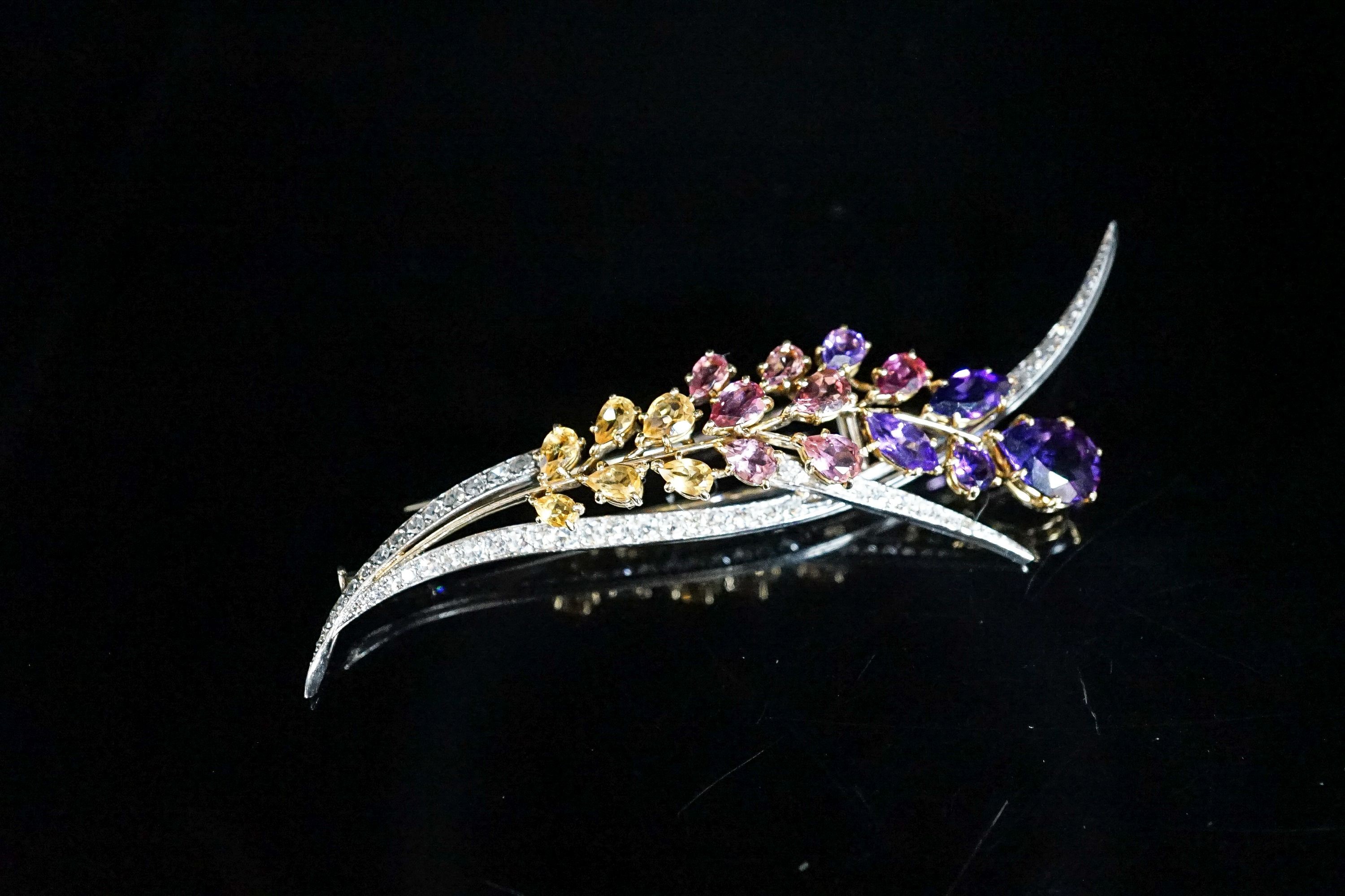 A French 18ct white metal, diamond and multi gem set floral spray brooch, 85mm, gross 17.4 grams.